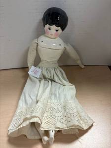 lot 288 image: Antique ceramic and plush body doll, blue eyes, with apron, 16 inch long