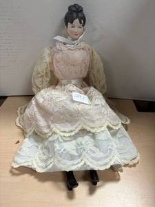 lot 291 image: Vintage bisque china doll, pink and lace dress