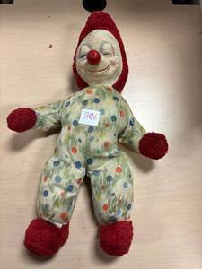 lot 296 image: Musical plush 1900s ideal clown doll, wood nose, wind up nose to play music