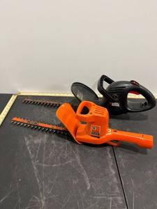 lot 1205 image: 2 Black & Decker Tree Hedgers (Both Power On)