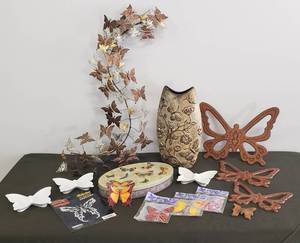 lot 7 image: Butterfly Decor - Metal Wall Hanger, Porcelain Ashtrays, Collector Tin, Resin Vase, Wood Wall Plaque Set, NIP Auto Art, and NIP Magic Kiss Butterfly Card Inserts