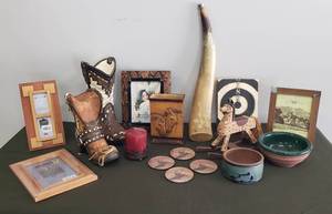 lot 9 image: Western Decor - Boot Planters, Wood & Snake Skin Design Frames, Deer Coaster Set & Candle Holder with Candle, Pottery PlanterBowls, Horse Vase, Wood Rocking Horse, & Longhorn Horn