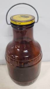lot 25 image: Vintage MOTTS Sunsweet Prune Juice Botte with Original Metal Lid & Metal Bail - 1 Gal. - Dark Amber Glass