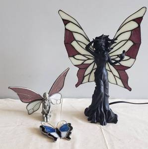 lot 35 image: Pewter Kneeling Fairy Figurine with Stained Glass Motion Wings, Stained Glass Butterfly Sun Catcher, & Large Fairy Lamp with Stained Glass Wings - one arm has damage.