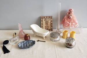 lot 37 image: Vintage Perfume Bottles, Tub Soap Dish, Mae West Wall Plaque, Etched Bud Vase, Shell Soap Dish, Lidded Powder Jar & Potpourri Jar, Bakelite FileToothbrush Holders, & Vintage 1950s Sleepy Eye Doll in Original Pink Netting Dress with Display Case