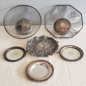 lot 66 image: Vintage Silver Plate Table Service Pieces - 2 BisquitBread Baskets, 3 Wine Bottle Coasters - 2 with Etched Glass, Footed Cheese Tray with Ornate Edge