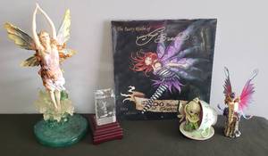 lot 88 image: Metal Winged Fairy on Stump, Tiny Cu-Tea #6205A Fairy in Tea Cup, & Large VERONESE Fairy Figurine Emerging from Pond 2pcs, I Do Believe in Faeries 2008 Calendar NIP, and Laser Etched Fairy Crystal on Light Base