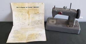 lot 91 image: Vintage SEW-ETTE Battery Operated Toy Sewing Machine with Original Instruction Sheet - Circa 1950s