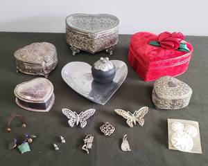 lot 93 image: Vintage Dresser Jewelry & Trinket Boxes - Heart Candle Plate, EarringPill Box, Smoke Quartz Earrings, 2 SARAH COVENTRY Filigree Butterfly Pins, Mother of Pearl Clip Earring & Pin Set Carved in Bethlehem, Bracelet with Jade Butterfly, & Necklace Pendants