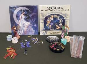 lot 110 image: Dragon Site Collector Fairy Figurines - Autumn Splendor & Spring Enchantment, Calgon Home Mini Tin Candles, Puzzle in Tin, Incense Sticks NIP, Fairy Illusions Metal Ornaments, 2008 Frost Moon Calendar NIP,  & 2008 Astrological Calendar NIP