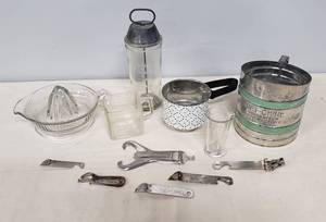 lot 113 image: Vintage Kitchen Tools & Utensils - Sift-Chine Hand Sifter, Measuring Beaker, Square Measuring Cup, Metal Can & Bottle Openers, Glass Juicer, Antique Malted Milk Mixer & Printed Metal Funnel Sifter