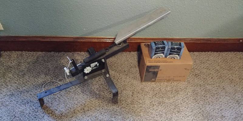 lot 105 image: Outers Mini Grand Target Trap, Box of Clay Targets, and 2 Boxes of 12 Gauge Shells