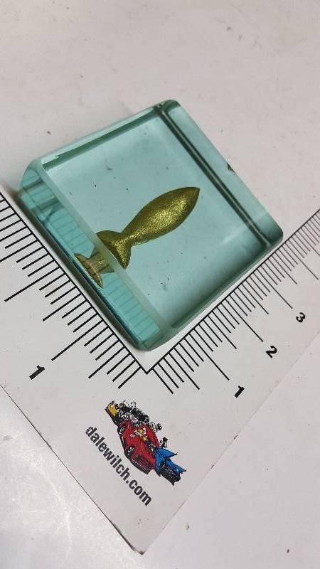 lot 5877 image: Glass paperweight with a gold fish inside.