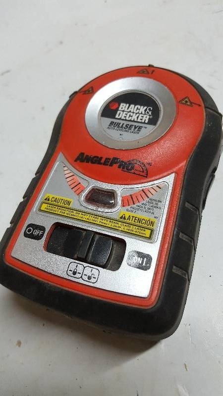 lot 5889 image: Black and Decker Bullseye Angle Pro Auto Leveling Laser Level. Needs batteries, but no corrosion on the terminals.