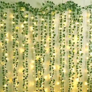 lot 81228 image: 12 Packs Artificial Ivy, 84FT Garland Hanging Plants Fake Vines with 200 LED String Light for Bedroom Wedding Party Garden Wall Room Home Decor