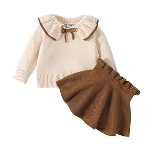 lot 82564 image: PATPAT 2pcs Baby Girl Solid Knitted Ruffle Trim Long Sleeve Top and Skirt Set Outfit Fall Winter Clothes 9-12M