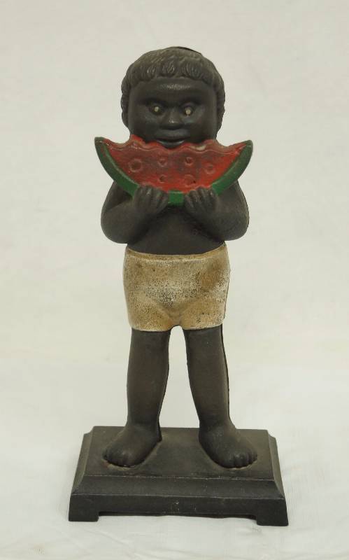 lot 7321 image: Black Cast Iron Americana Standing Watermelon Boy Vintage Penny Coin Bank