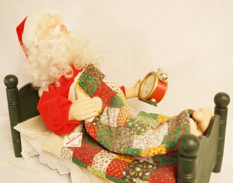 lot 2314 image: Snoozing Santa Animated Figurine - Hes resting after Christmas So cute See video