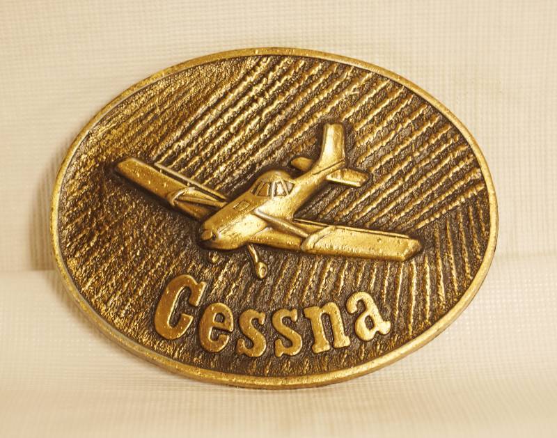 lot 2325 image: Cessna Belt Buckle Airplane - Neat