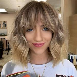 lot 40043 image: KOME Curly Bob Wig with Bangs Short Wavy Blonde Highlight Wigs for Women Bob Style Synthetic Heat Resistant Bob Wigs 14IN