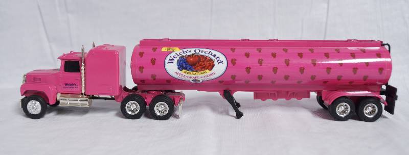 lot 7346 image: ERTL - Die Cast Semi Replica FORD 164 LTL-9000 w Sleeper - Welchs Orchard Trailer - PINK Cool