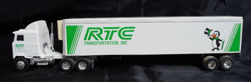 lot 2219 image: ERTL Die Cast Replica - 164 MACK Ultra-Liner w Sleeper Semi Truck w. Trailer RTC Transportation, Inc. Georgia
