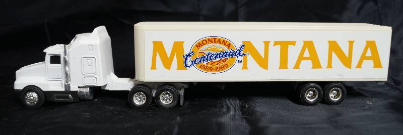 lot 2227 image: ERTL - Die Cast Replica - Kenworth T600A - Semi Truck w trailer  - MONTANA Centennial 1889-1989 - COOL