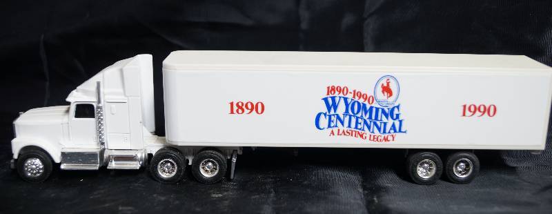 lot 2233 image: ERTL - Die Cast Replica - International Navistar Semi Truck w Trailer - WYOMING Centennial 1890-1990 WOW