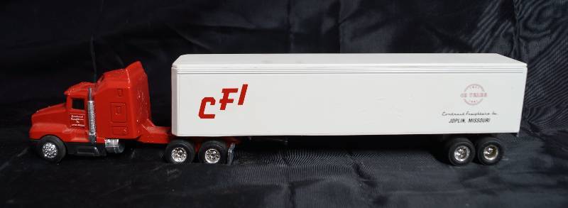 lot 2234 image: ERTL - Die Cast Replica - Kenworth T600A - 0420G Semi Truck w trailer  - CFI - Contract Freighters Inc. - 40years
