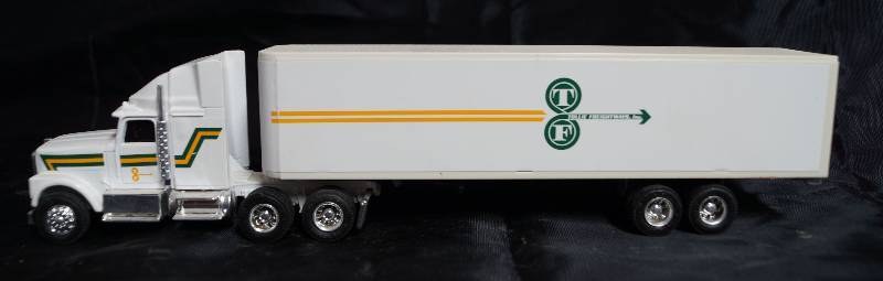 lot 2238 image: ERTL - Die Cast Replica - International Navistar Semi Truck w Trailer - TOLLIE FREIGHTWAYS - 1357-7513