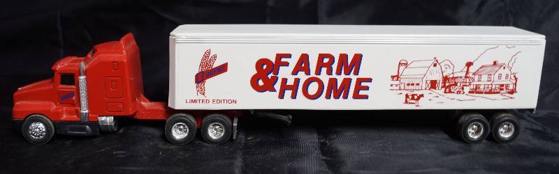 lot 2245 image: ERTL - Die Cast Replica - Kenworth T600A - 0560G - Semi Truck w trailer  - CFI - FARM & HOME - 8200 8812