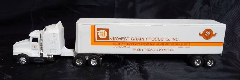 lot 2248 image: ERTL - Die Cast Replica - Kenworth T600A - Semi Truck w trailer  - MIDWEST GRAIN PRODUCTS, INC. - 50 Years