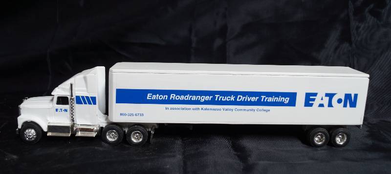 lot 2249 image: ERTL - Die Cast Replica International Navistar Semi Truck & Trailer - EATON Roadranger Truck Driver Training - Neat
