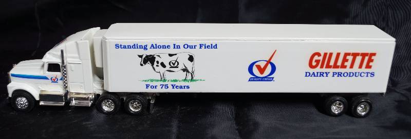 lot 2254 image: ERTL - Die Cast Replica International Navistar Semi Truck & Trailer - GILLETTE DAIR PRODUCTS - 75 Years WOW