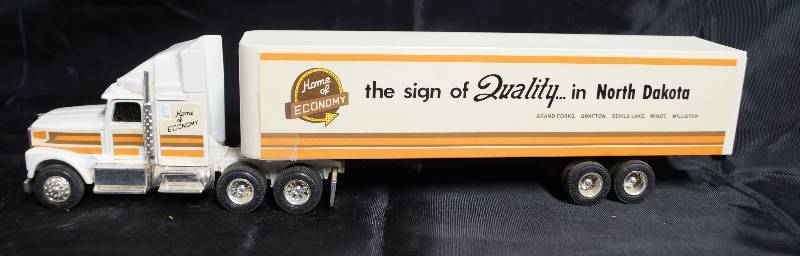 lot 2272 image: ERTL - Die Cast Replica - International Navistar Semi Truck w Trailer - Home of ECONOMY - North Dakota - COOL