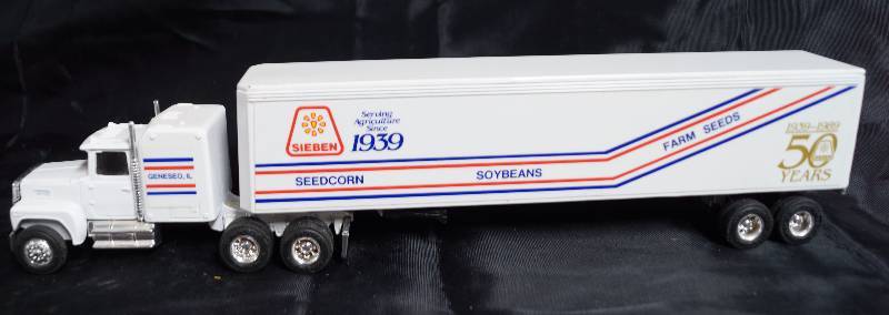 lot 2278 image: ERTL - Die Cast Replica - 164 Ford LTL-9000 w Sleeper Semi Truck w Trailer - SIEBEN Agriculture 50 Years 1939-1989