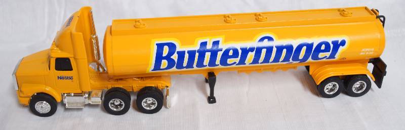 lot 2291 image: ERTL - Die Cast Replica - WHITEGMC - WCA Conventional Aero - BUTTERFINGER CANDY Tanker Trailer - SWEET