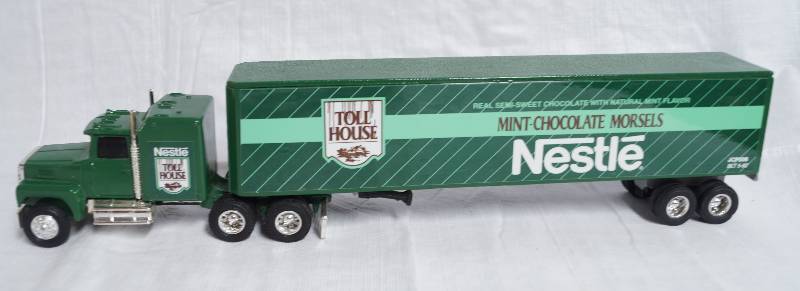 lot 2293 image: ERTL - Die Cast Replica - 164 Ford LTL-9000 w Sleeper Semi Truck w Trailer - NESTLE Mint Chocolate Morsels - SWEET