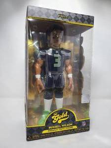 lot 31 image: New In Box Funko Gold Russell Wilson Premium Vinyl Figure