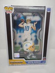 lot 84 image: New In Box Funko Pop Justin Herbert San Diego Chargers with Giant Prizm Football Trading Card