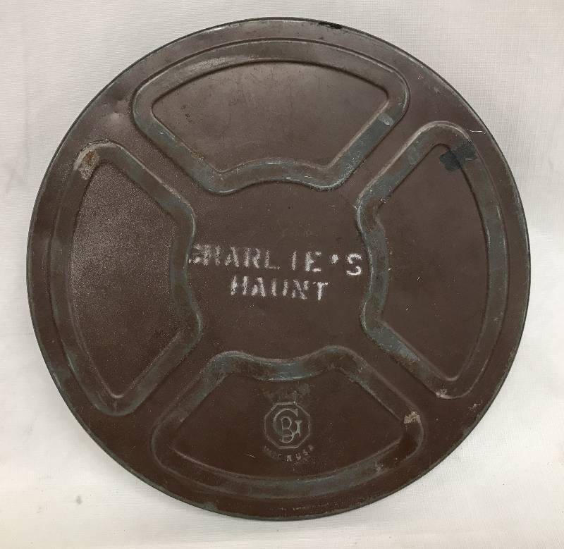 lot 1962 image: Vintage Movie Film Canister - GB Made in U.S.A. - painted w CHARLIES HAUNT on the cover - NICE