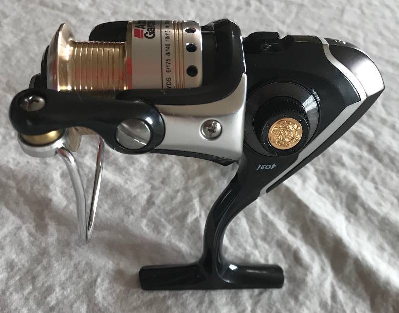 lot 3039 image: NEW - Abu Garcia Cardinal 402i 8-Bearing Spinning Fishing Reel - Reversible Right or Left Hand Retrieve