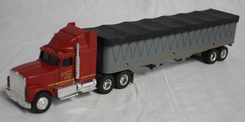 ERTL Die Cast Replica International NAVISTAR Semi Truck w Trailer Simon s Feed Store 1807G AMMUNITION ERTL SEMI TRUCKS Collectible CARS MORE ALL BIDS START AT 1.00 Equip Bid