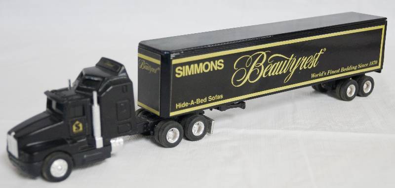 lot 4244 image: ERTL - Die Cast Replica Kenworth T600A Semi Truck Simmons w Trailer 1989G