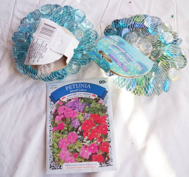 lot 4131 image: Assortment of Garden Supplies- Petunia Flower Seeds and Flat Glass Marbles
