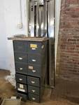 Metal file cabinet and stainless steel behind