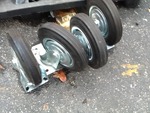 Set of new 8 inch industrial casters as pictured