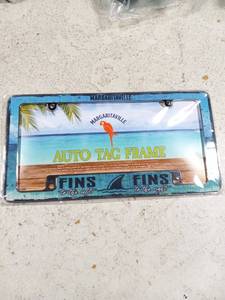 lot 41756 image: Rico Industries Margaritaville 12 x 6 Chrome All Over Automotive License Plate Frame for CarTruckSUV