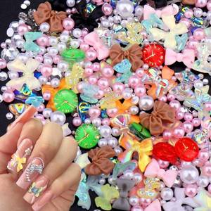 lot 42139 image: Juome Nail Charms, 1900 Pcs Kawaii Nail Charms Pearls 3D Resin Butterfly Bow Clock Shape Charms for Nails Gems, Nail Art Decorations Supplies