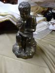 Brass thinker statue